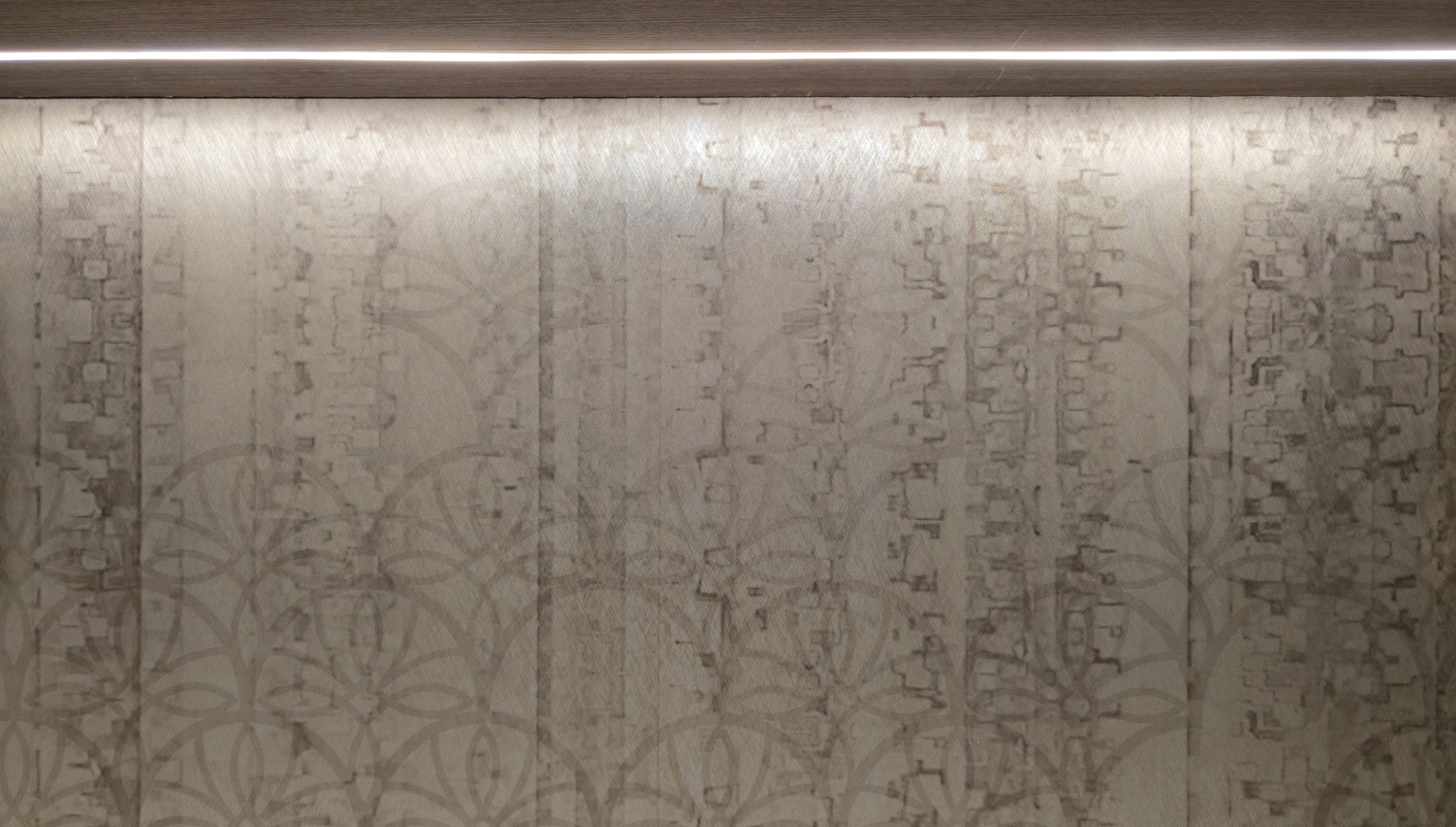 Classic brown wallpaper on the wall with lights above in a luxury hotel.